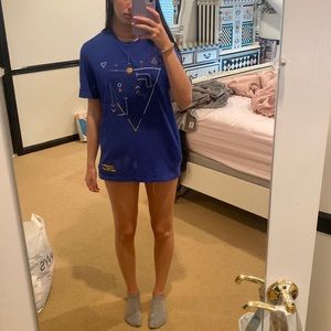 Blue t shirt, gently warn, small/medium men’s. I am 5’6 for reference